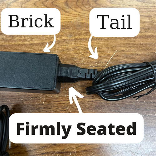 brick and tail of a charger firmly seated together